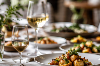 Concept image of food and wine on a dinner table